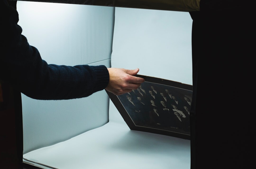 Editor reviewing archive videotapes on a lightbox